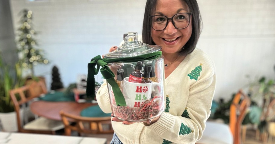 woman holding coffee bar in a jar 