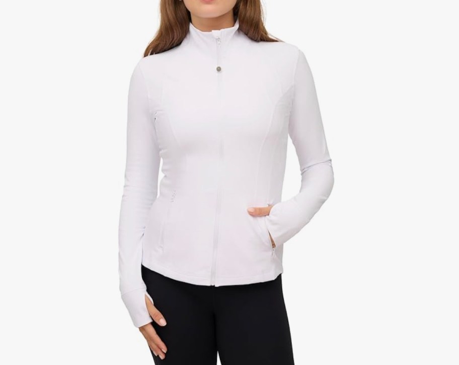 stock photo of woman wearing white zip jacket