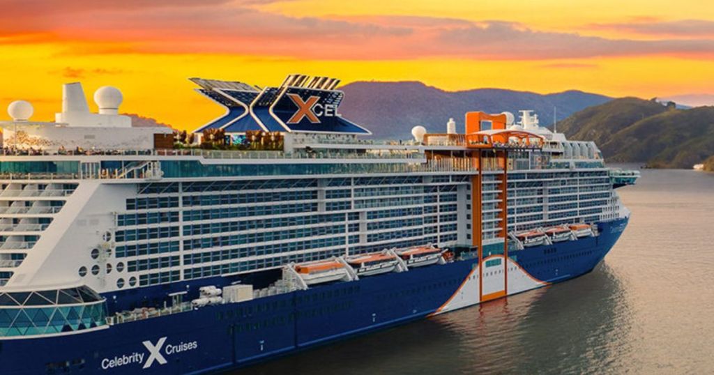 A celebrity cruise line ship on the water at sunset