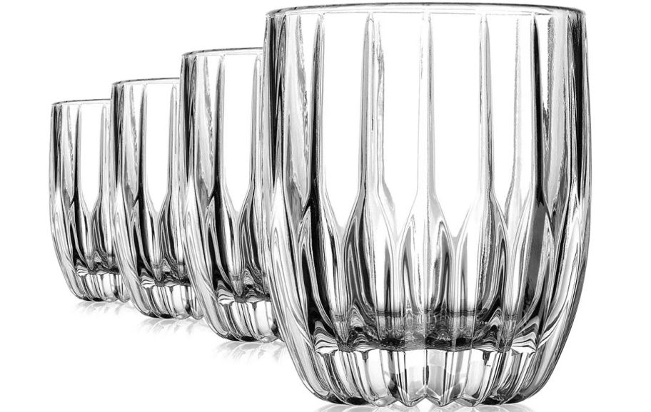 set of four old fashioned glasses stock image