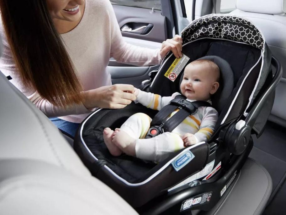 Graco SnugRide 35 Lite LX Infant Car Seat in car with baby in it