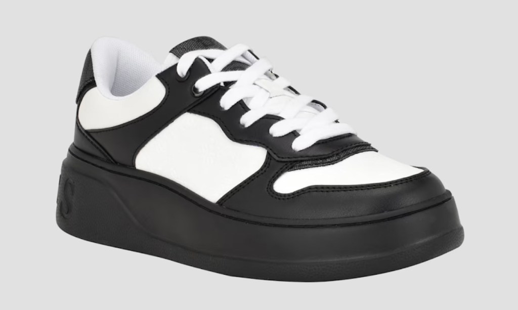 Stock photo of black and white sneakers with black platform soles