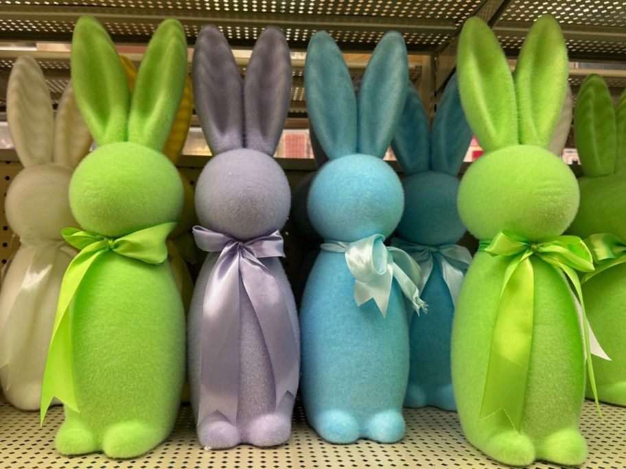 A shelf of Large Flocked Bunny Decorations at Hobby Lobby