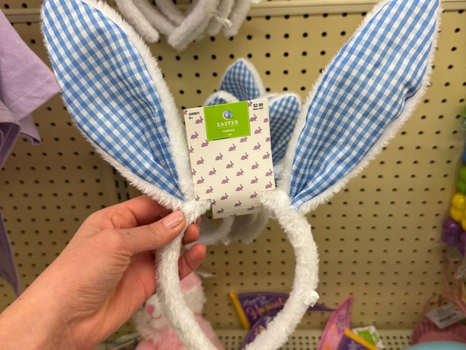 Hand holding a Blue Gingham Easter Bunny Ears Headband