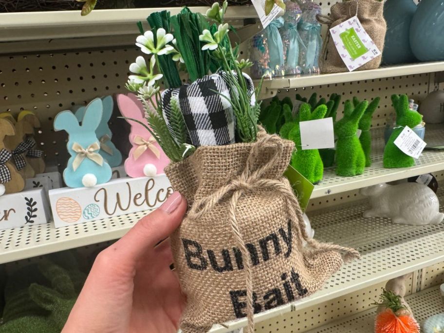 Hand holding a Bunny Bait Floral Decoration from HObby Lobby