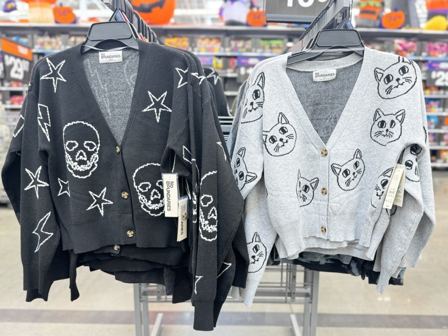 black and grey cropped cardigans on display rack in store