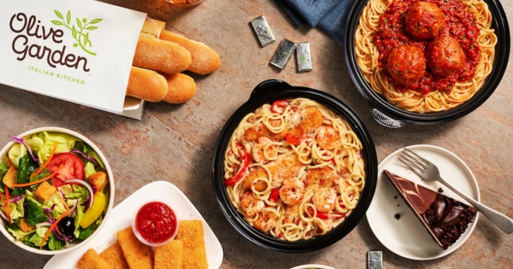 Olive Garden, breadsticks salad, pasta, and appetizers on table top