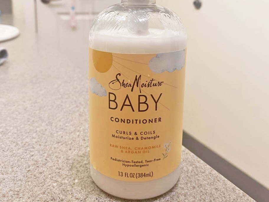 bottle of SheaMoisture Baby Conditioner on bathroom counter