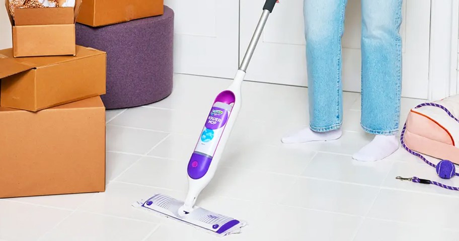 woman using Swiffer PowerMop on tile floor