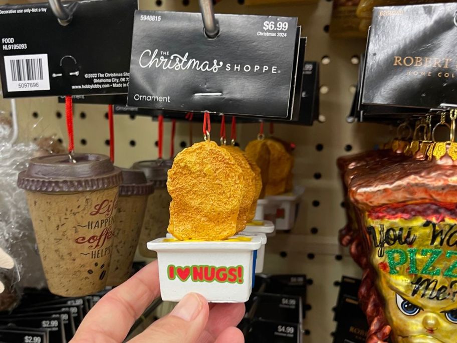 The Christmas Shoppe Chicken Nugget Ornament in hand in store