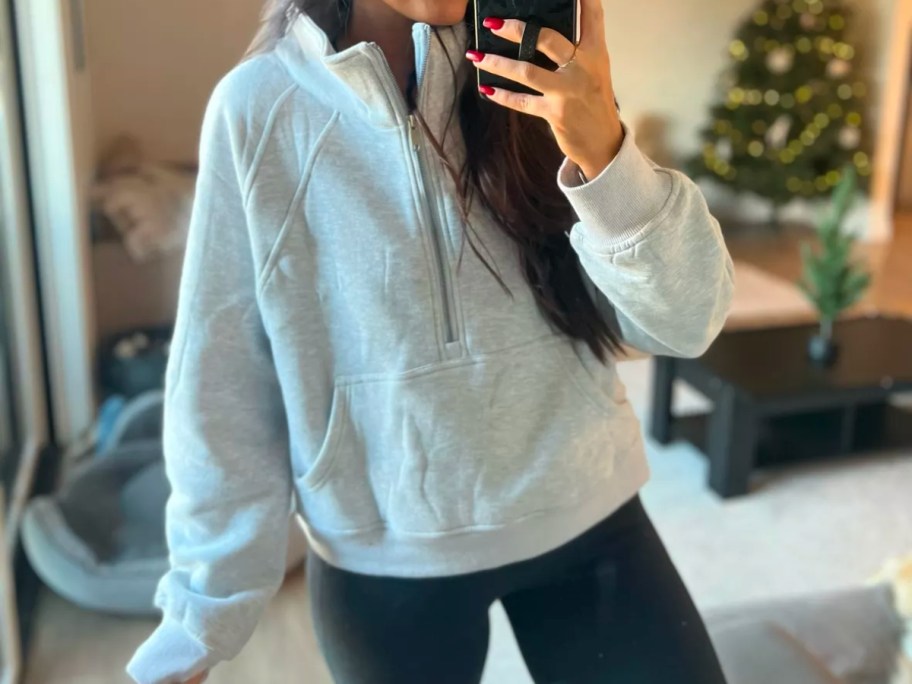 woman wearing a lululemon scuba lookalike Cropped Quarter Zip Pullover from Amazon