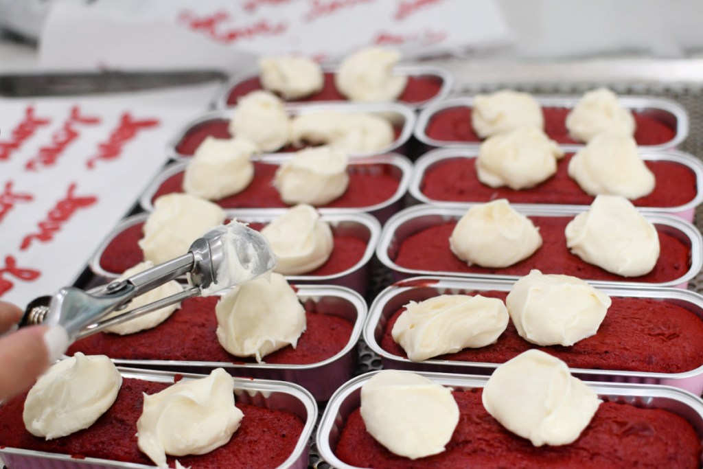 adding cream cheese to red velvet valentine's day cake