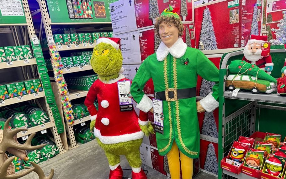 the grinch and buddy elg on display in a home depot