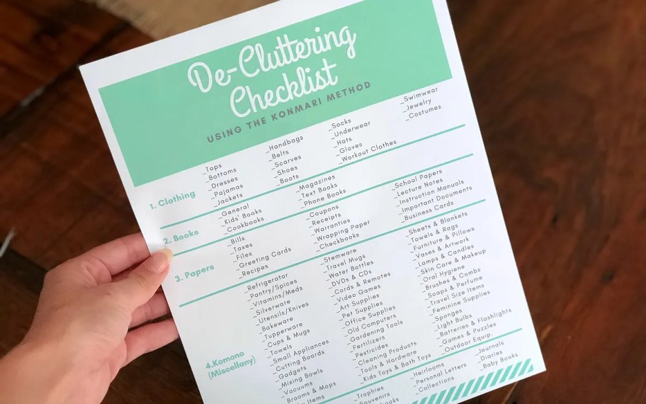 hand holding decluttering checklist printable