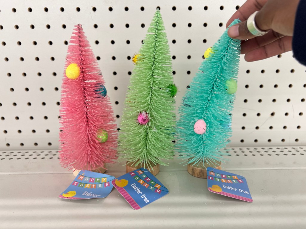 pink green and blue bottle brush trees with eggs