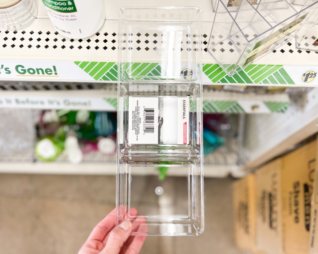 hand pulling acrylic organizer off shelf