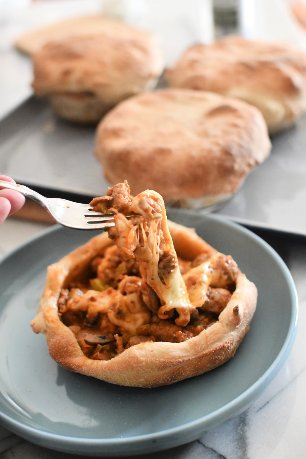 eating pizza pot pie with a fork