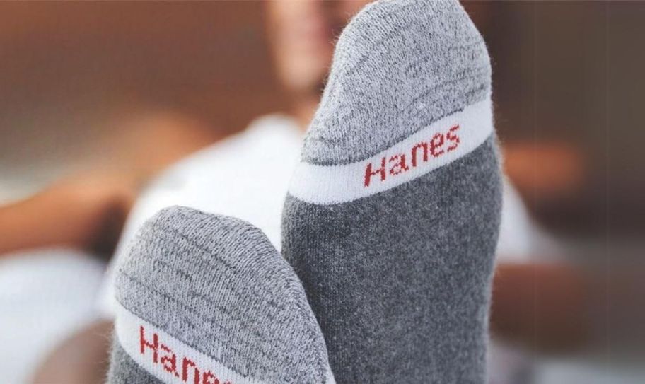 a person's feet shown in a pair of hanes cushion onlinefort socks