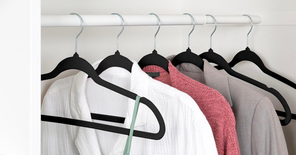 honey can do black velvet hangers with clothes in closet