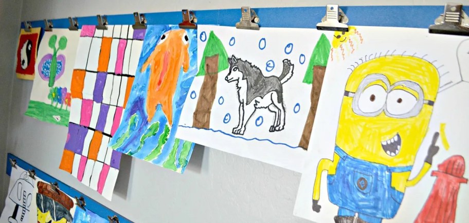 kids handing artwork