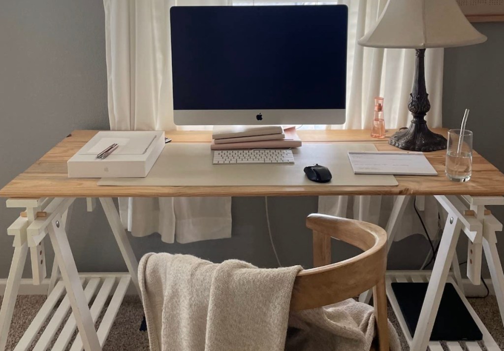 minimal office desk with apple onlineputer and leather desk pad