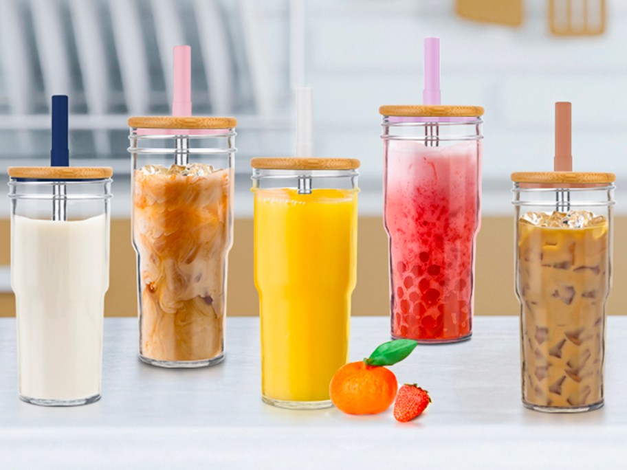 mason jar glasses on counter full of different juices