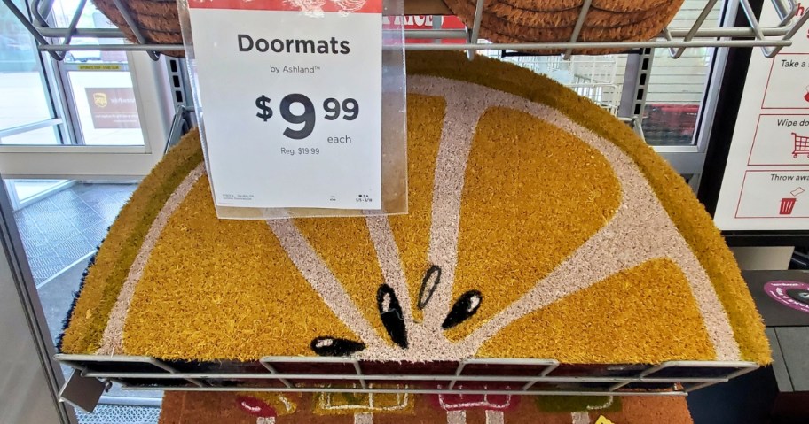 Lemon slice coir doormat on display with a sale sign