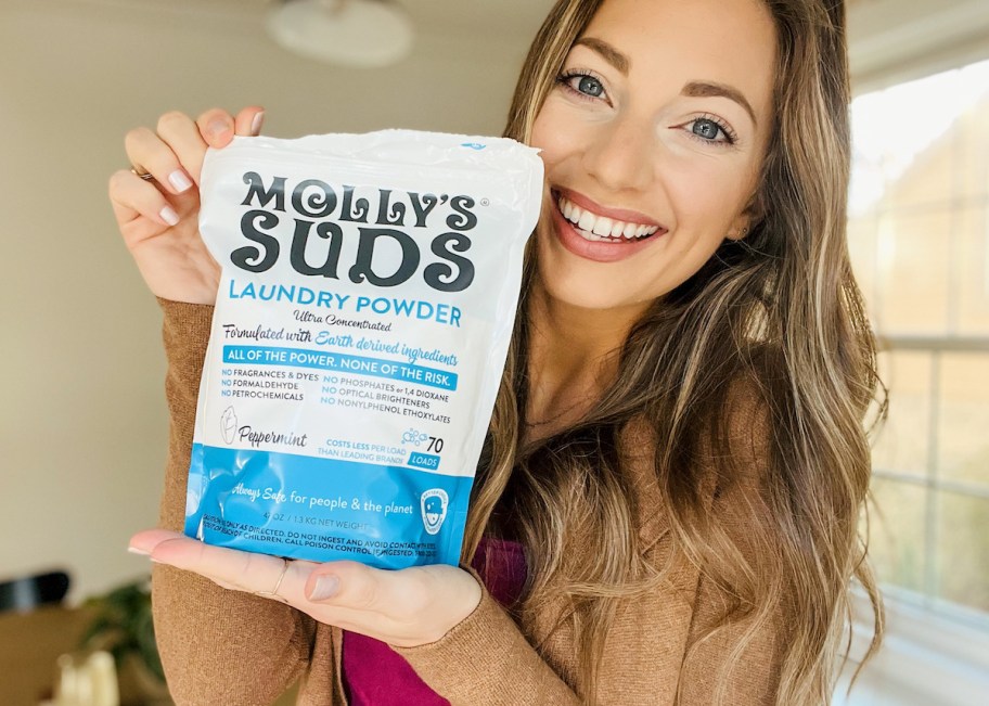 woman holding bag of peppermint laundry detergent