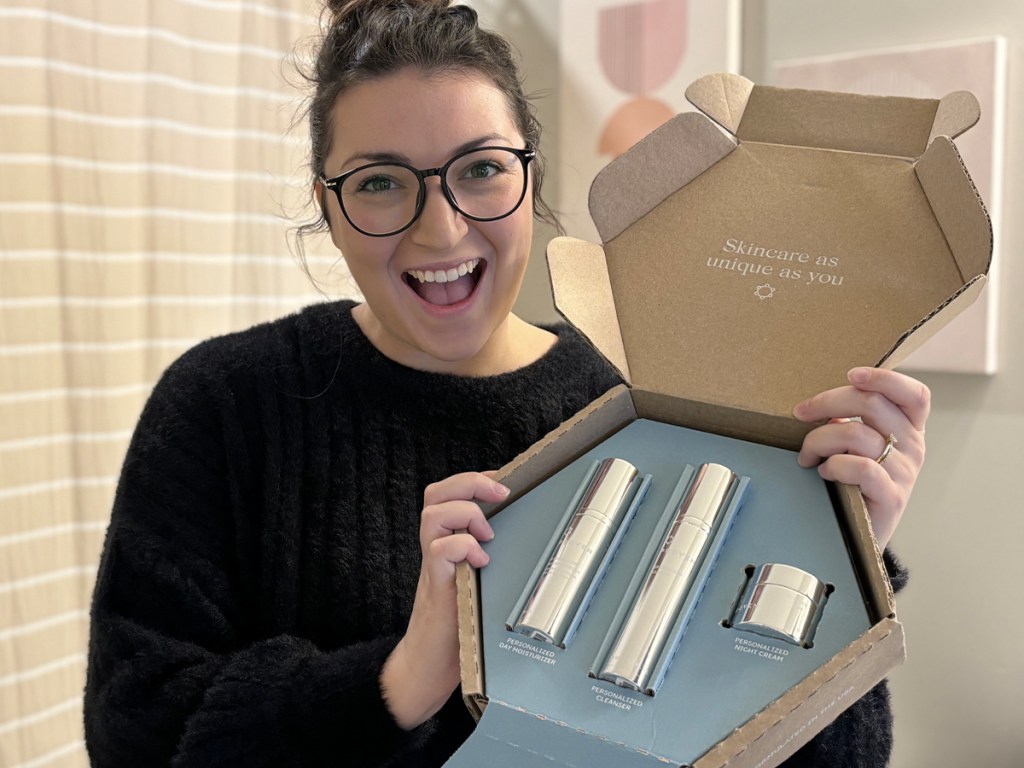 woman holding proven skincare box with products inside 