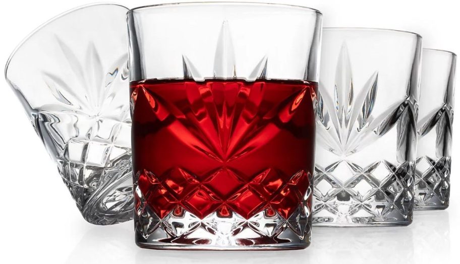 set of four old fashioned glasses stock image