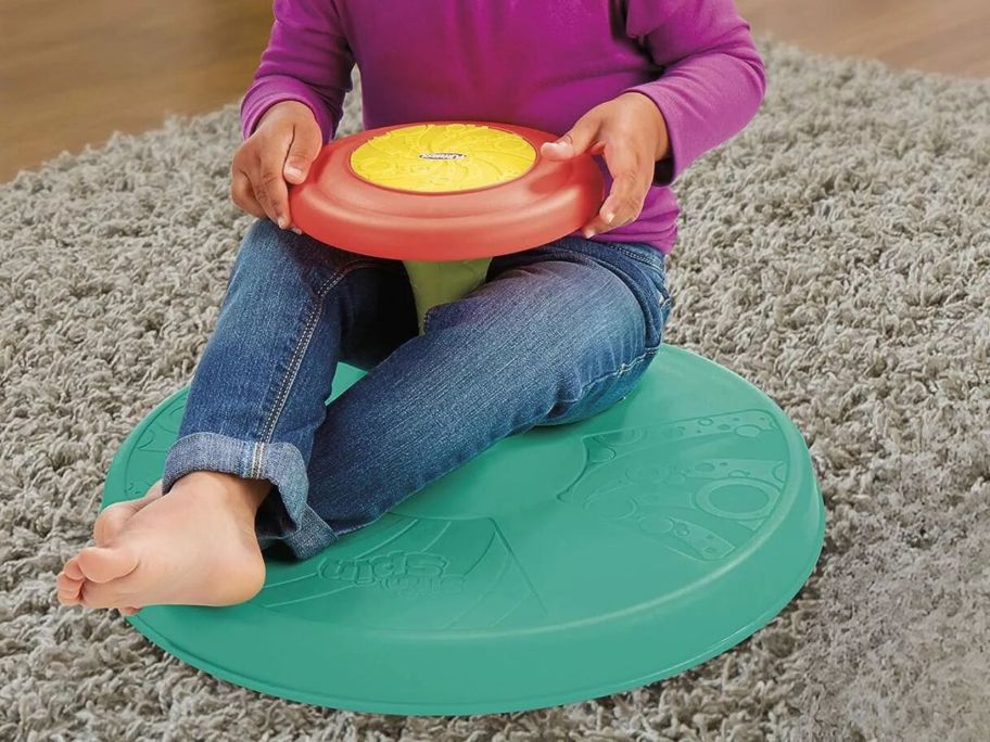 toddler on sit and spin toy