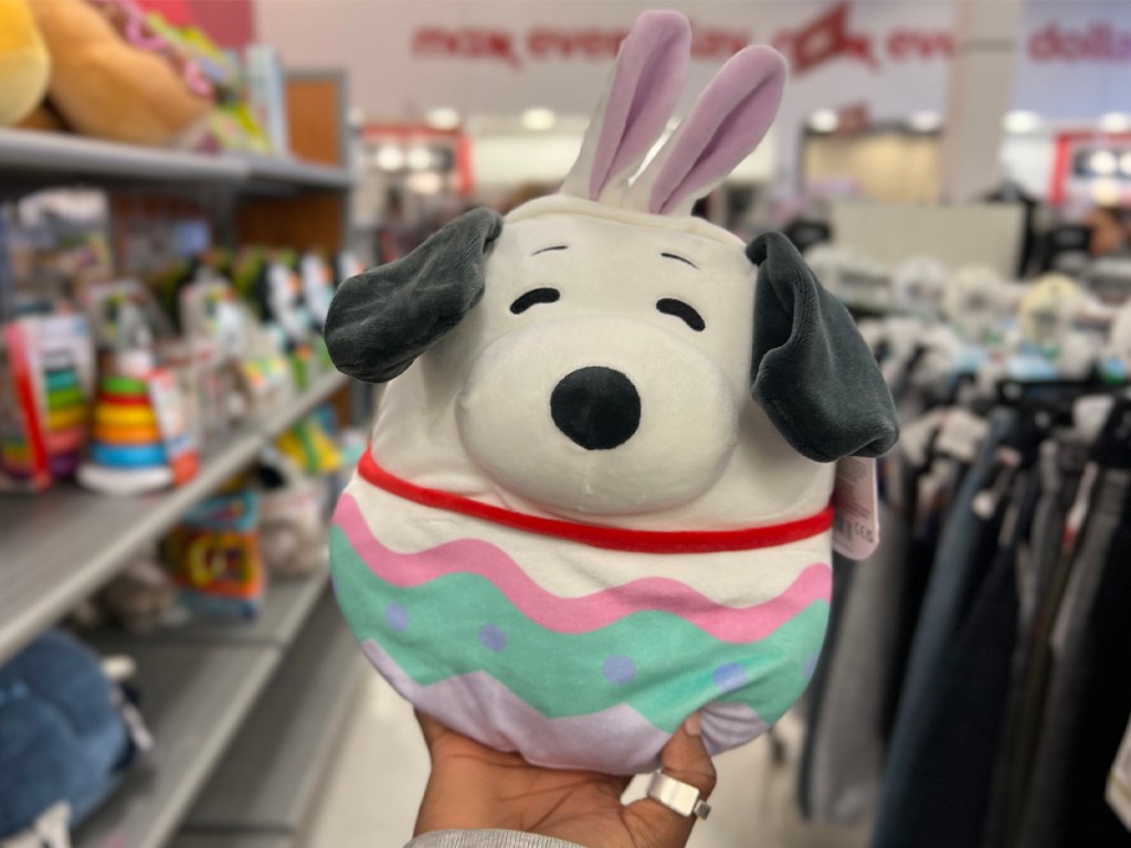 hand holding snoopy peanuts easter squishmallow