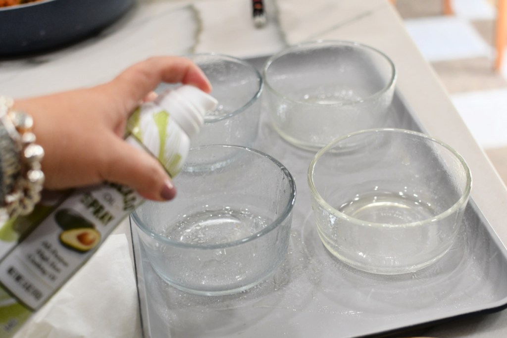 spraying bowls with oil