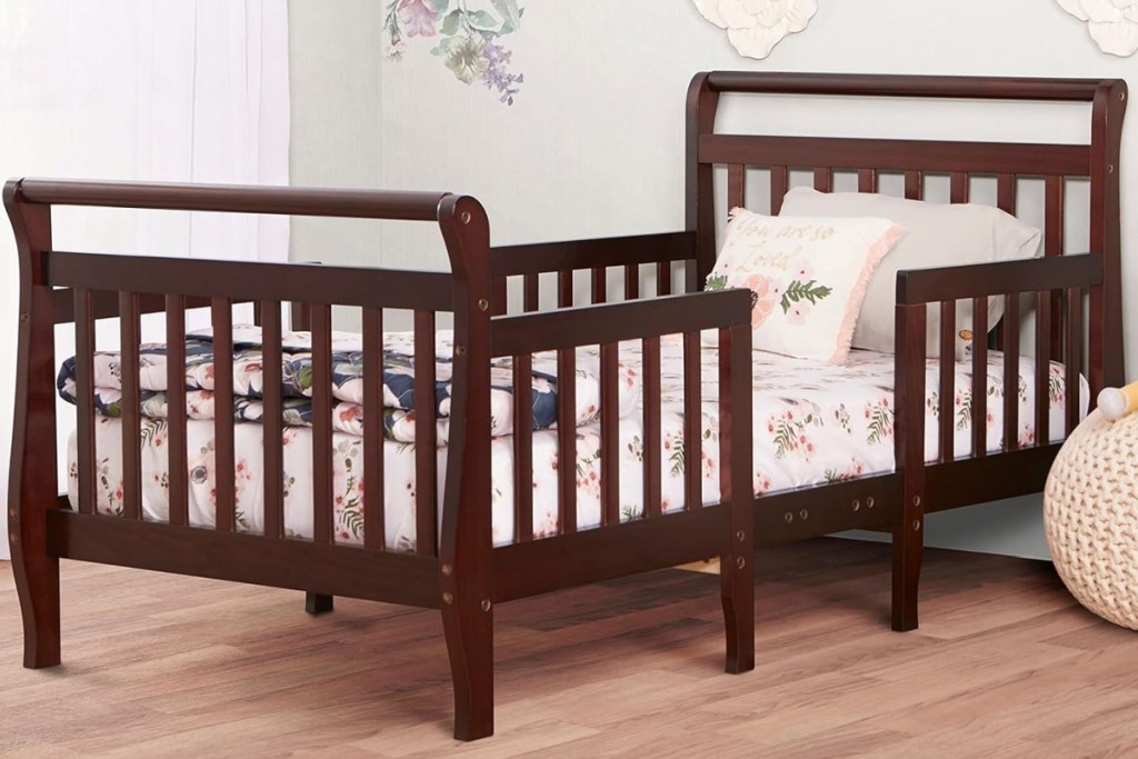 brown wooden toddler bed