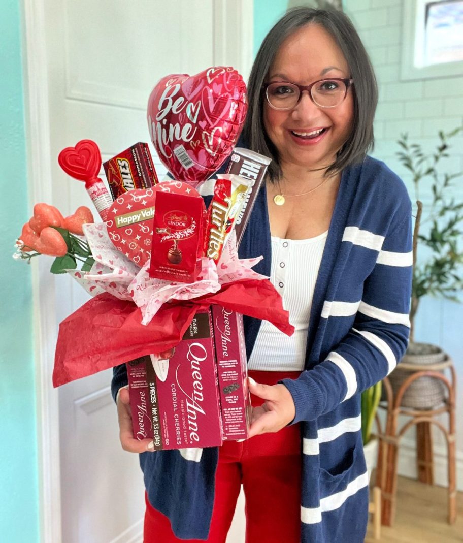 woman holding a bouquet of candy from dollar tree for valentine's day