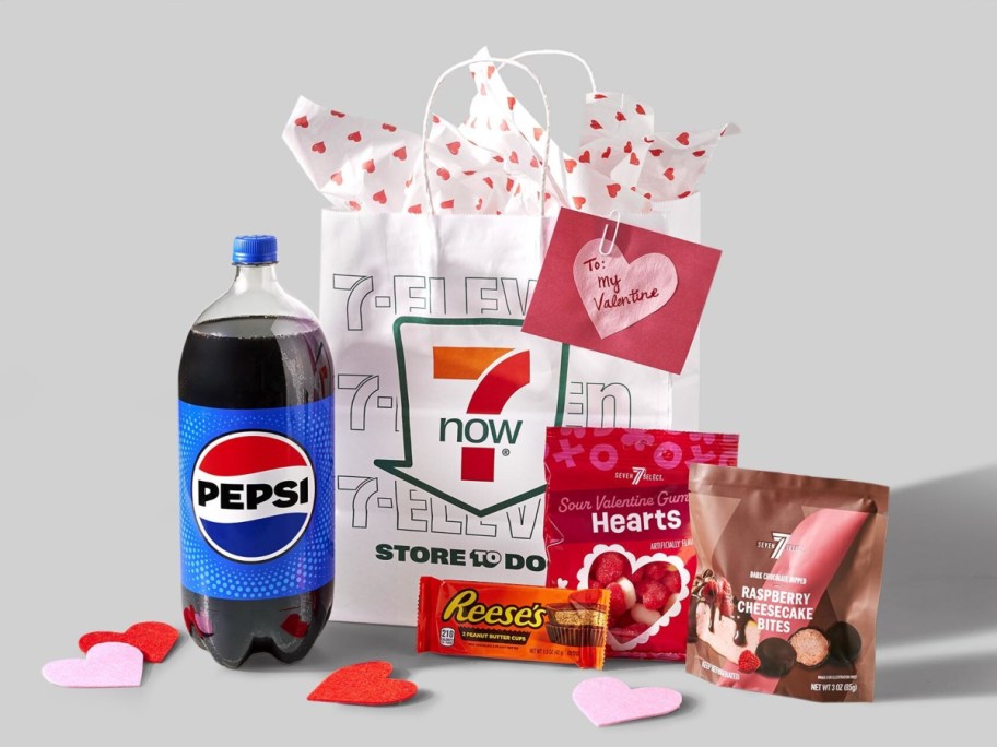 convenience groceries and paper hearts next to a white 7 Eleven bag