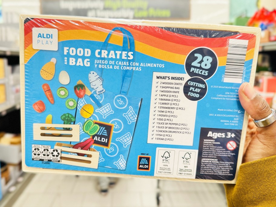 hand holding up ALDI 28-Piece Food Crates & Bag Play Set