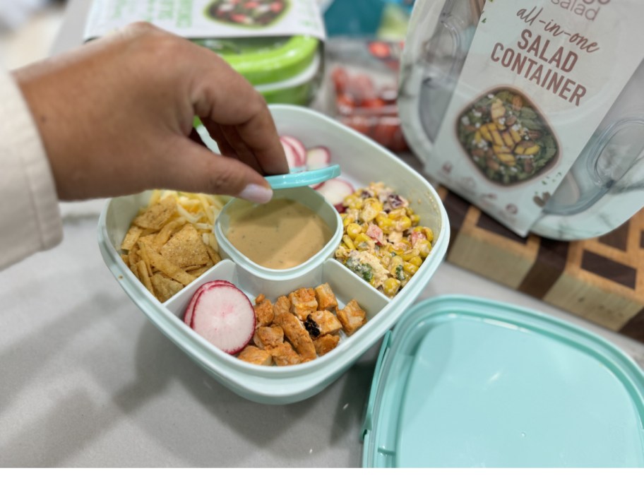 Woman, eating salad from Bengo container