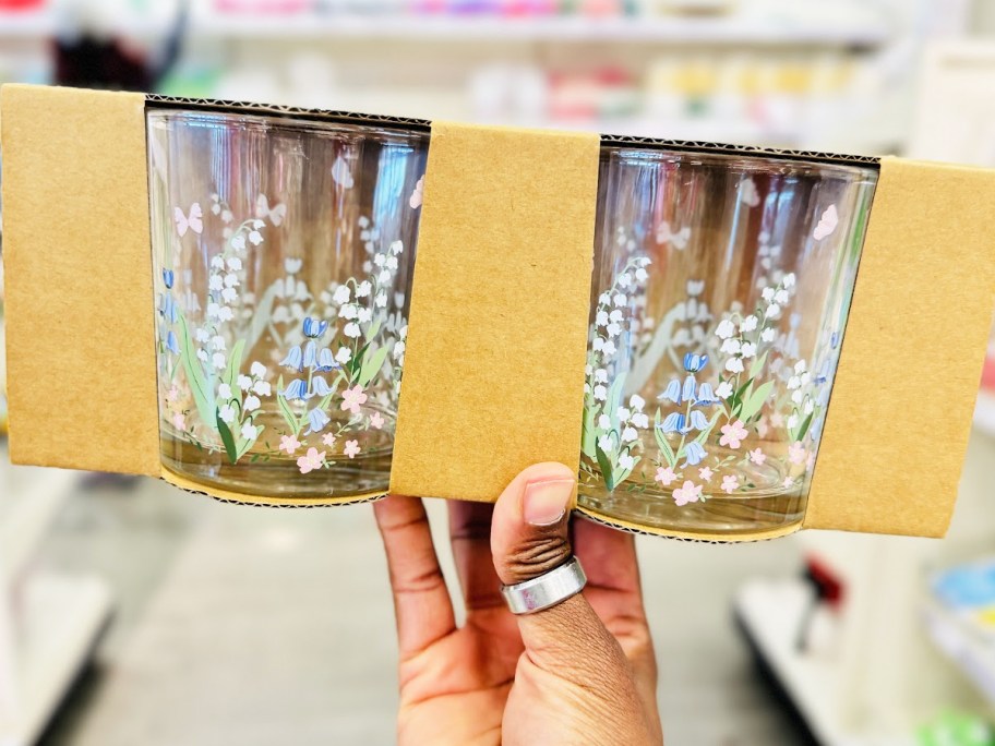 hand holding up a set of floral print glasses