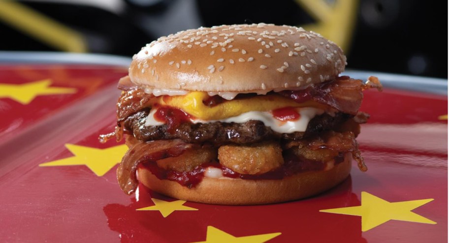 Carl jr hangover burger displayed on top of a car