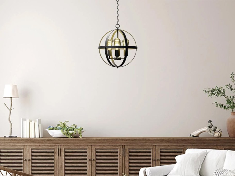 round black pendant light hanging in living room