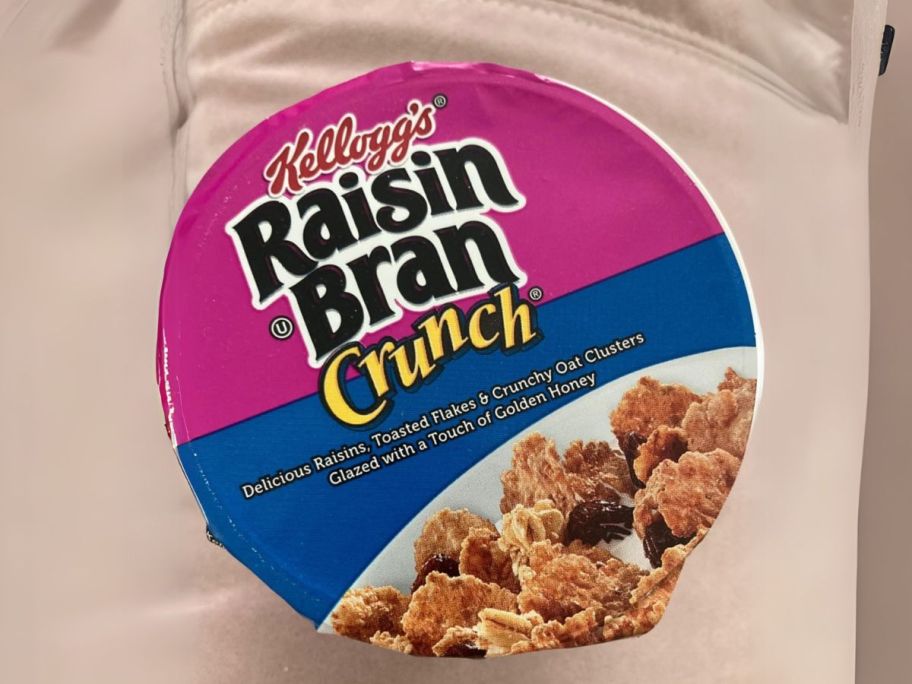 Kellogg's Raisin Bran Crunch Breakfast Cereal Cup on table