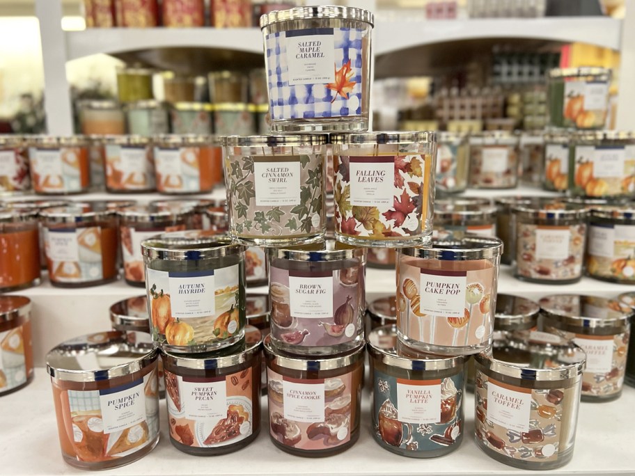 stack of fall candles on store display table