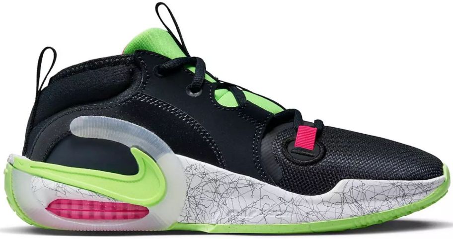 a black and neon green kids basketball shoe