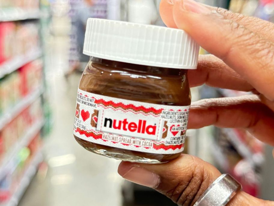 hand holding Nutella Mini Jar in store