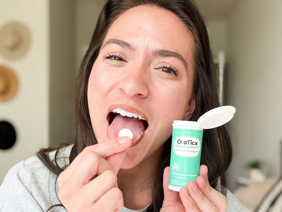 woman putting a OraTicx Green Breath in her mouth