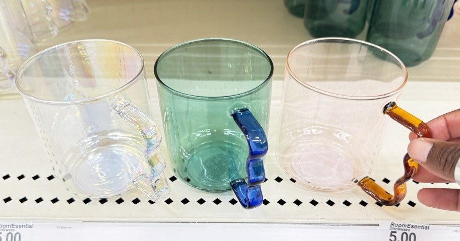 three glass mugs with wavy handles