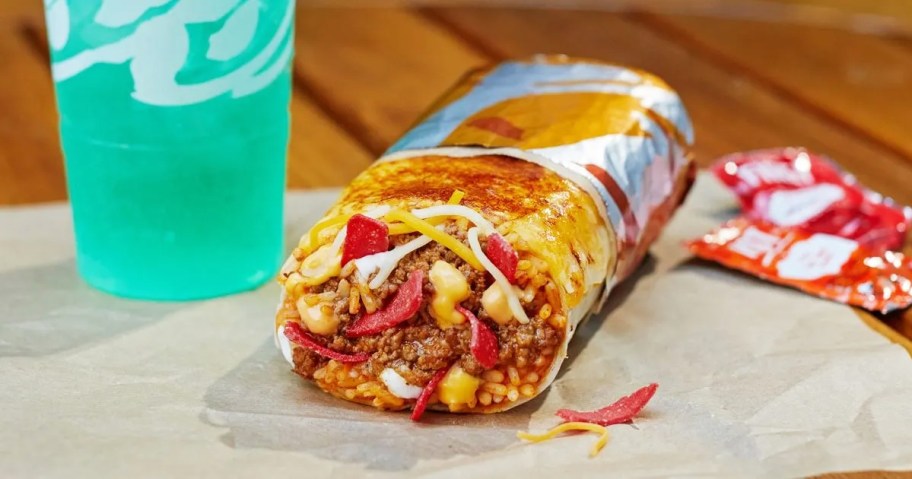 burrito next to blue fountain drink