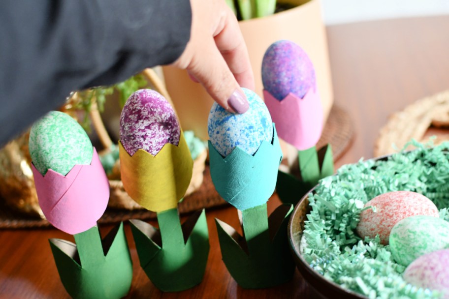 adding eggs to tulip cardboard flowers