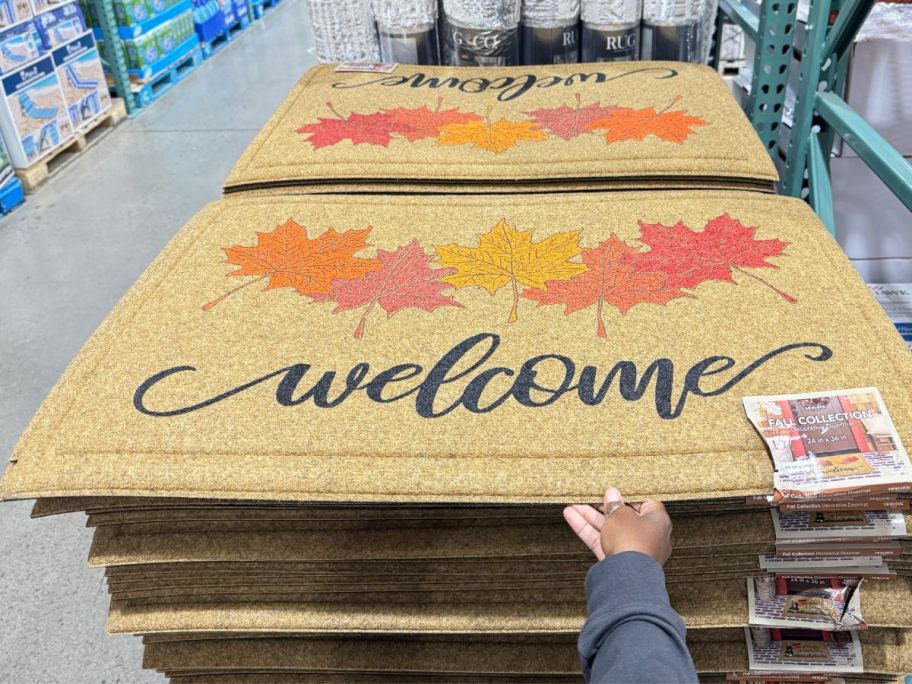 costco welonlinee fall doormats stacked on display in store